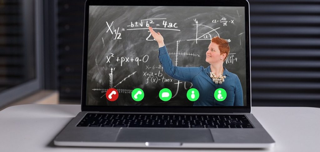 Virtual classes in maths with a female teacher showing a difficult formular. Virtual classrooms are one option, how Edtech will change teaching and learning for the long term.